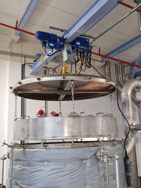 The 2-ton swl (safe working load) hoists raise and lower sealed vessel lids and baskets containing raw materials used in the production of gin.