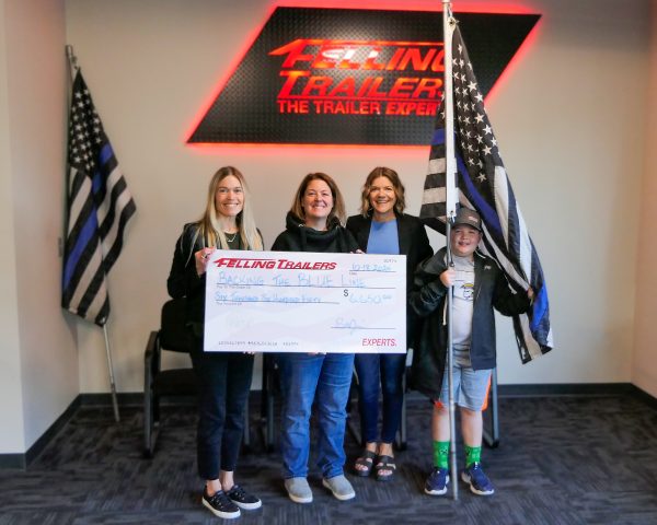 Trailer for a Cause check presentation to Backing the Blue Line (L-R) Brenda Jennissen, Gretchen Gifford, Bonnie Radjenovich, and Calvin Gifford.