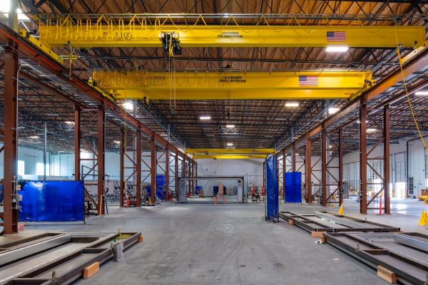 A combination of four overhead bridge cranes and two hoists were required.image