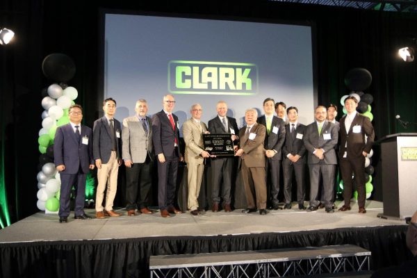 The formal presentation of the building plaque commemorating the CLARK Global Headquarters Grand Opening in Flower Mound, Texas.
